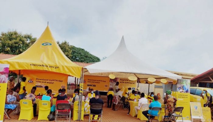 Customers registering their SIM cards at Temporary Registration point at Madina market